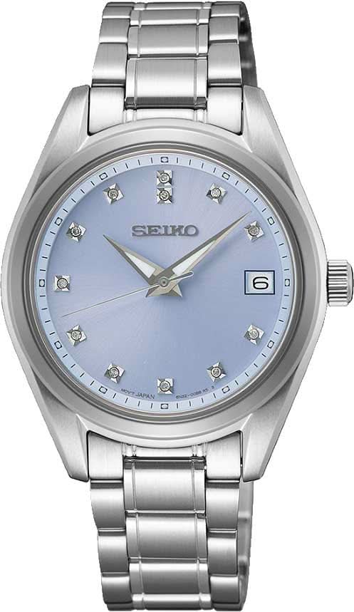 Reloj de mujer de acero inoxidable con esfera azul, índices de diamantes y visualización de fecha.