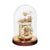 Reloj de mesa con mecanismo dorado bajo campana de cristal, base redonda en marrón oscuro