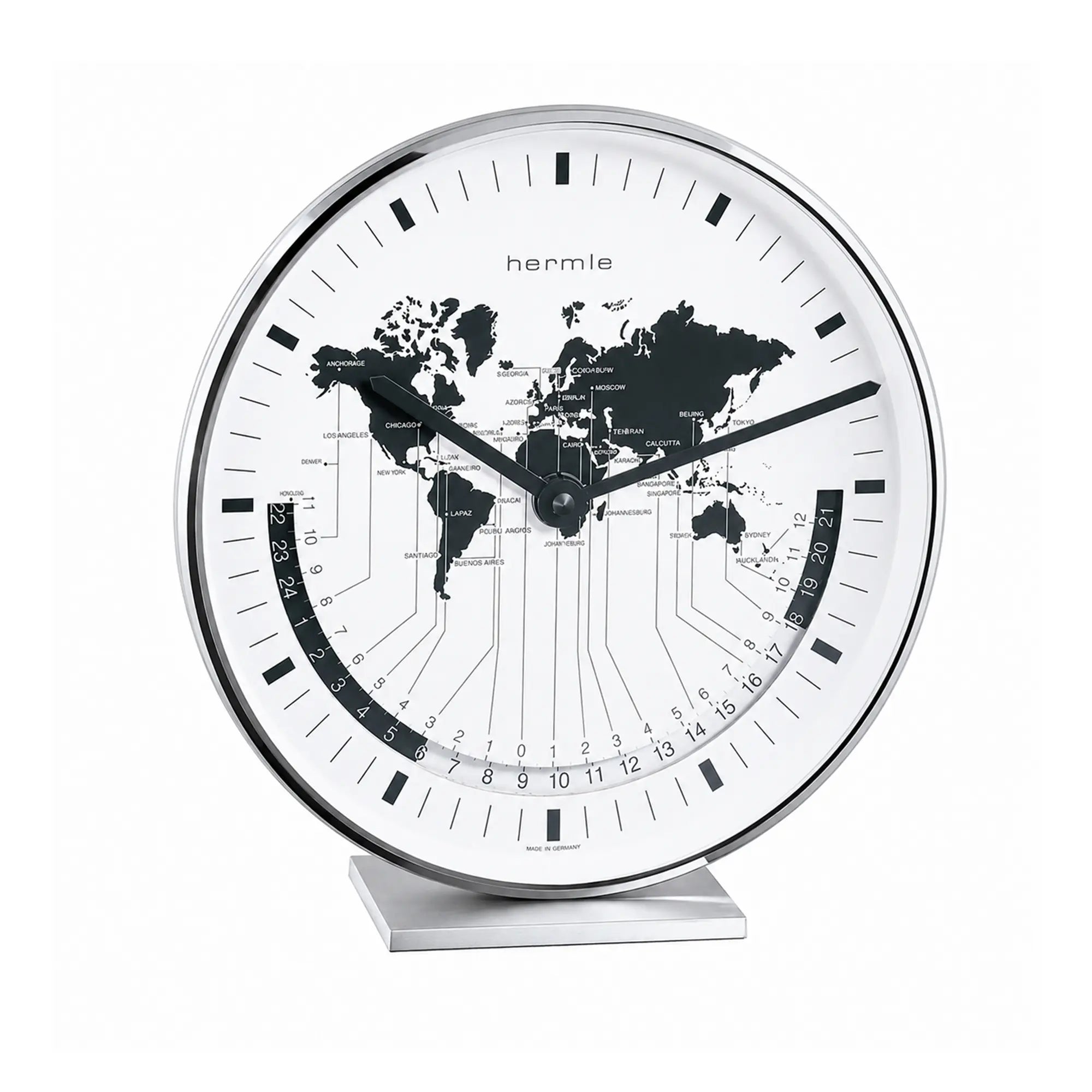 "Reloj de mesa metálico con esfera blanca y mapa del mundo, manecillas y escala negras"