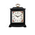 Reloj de mesa negro con carcasa de madera, asa dorada y esfera floral