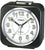 Reloj despertador analógico compacto de plástico negro con esfera y manecillas claras