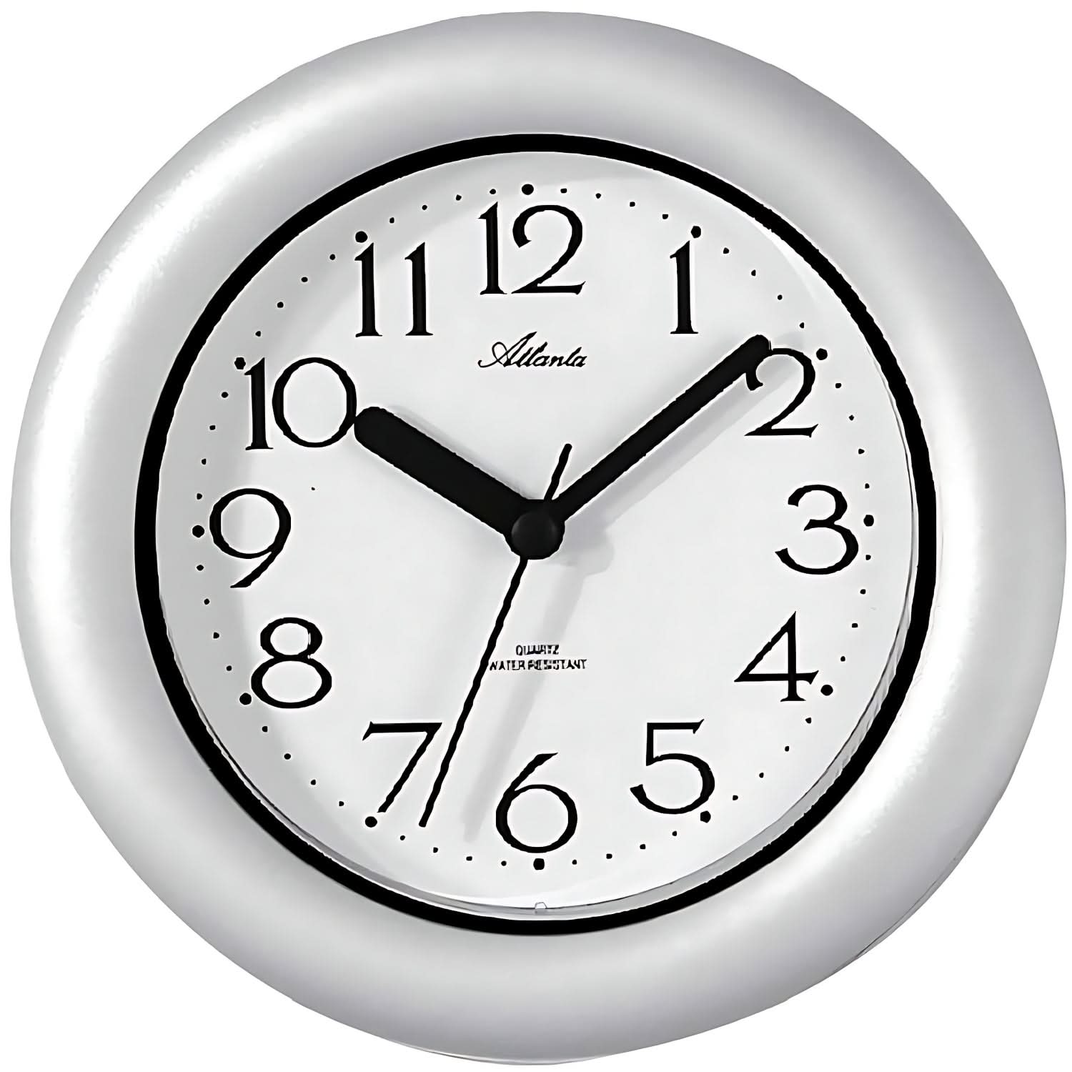 Reloj de pared plateado con esfera blanca, números y manecillas negras, redondo de 17 cm