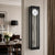 Reloj de pared con marco negro y fondo gris, esfera redonda, péndulo