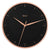 Reloj de pared Hermle con esfera negra, manecillas de oro rosa y borde metálico