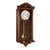 "Reloj de pared de madera oscura con esfera blanca y ornamentos de péndulo delicados"