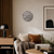 AMS LED-Wortuhr mit rundem gesprenkeltem Zifferblatt, an heller Wand