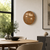 Runde LED-Wanduhr mit braunem Zifferblatt und leuchtender Wortanzeige an der Wand