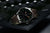Reloj de hombre con bisel de acero inoxidable y correa de cuero marrón, números luminosos
