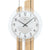 Wanduhr-Zifferblatt mit schwarzen Zeigern, AMS-Logo und Mineralglas-Optik