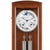 Reloj de pared de madera con frente de cristal, caja marrón, esfera redonda y péndulo