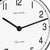Esfera de reloj de mesa con superficies blancas, manecillas negras y el texto "hermle"