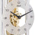 "Reloj de mesa Hermle Detalle: esfera blanca con números y mecanismo de latón visible."