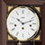 Esfera de reloj de pared con números romanos, manecillas y logotipo de Hermle